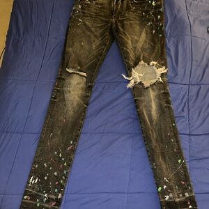 AMIRI Black Distressed Skinny Jeans with Colorful Paint Splatter